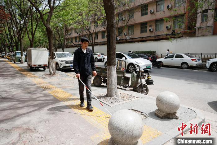 西安视障青年谭维乐：用镜头记录“看不见”的世界